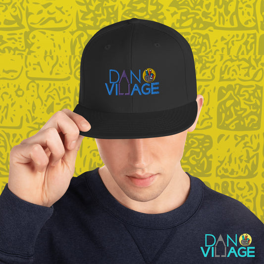 Embroidered artist cap carrying the colorful Danvillage flag logo, wearable art for creatives