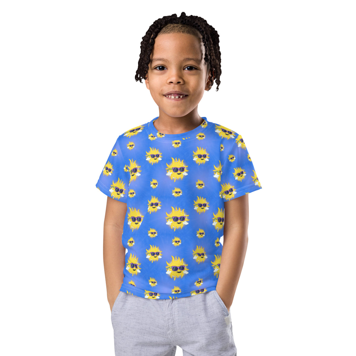 Summer graphic tee for kids covered in cheerful hand-drawn smiling suns