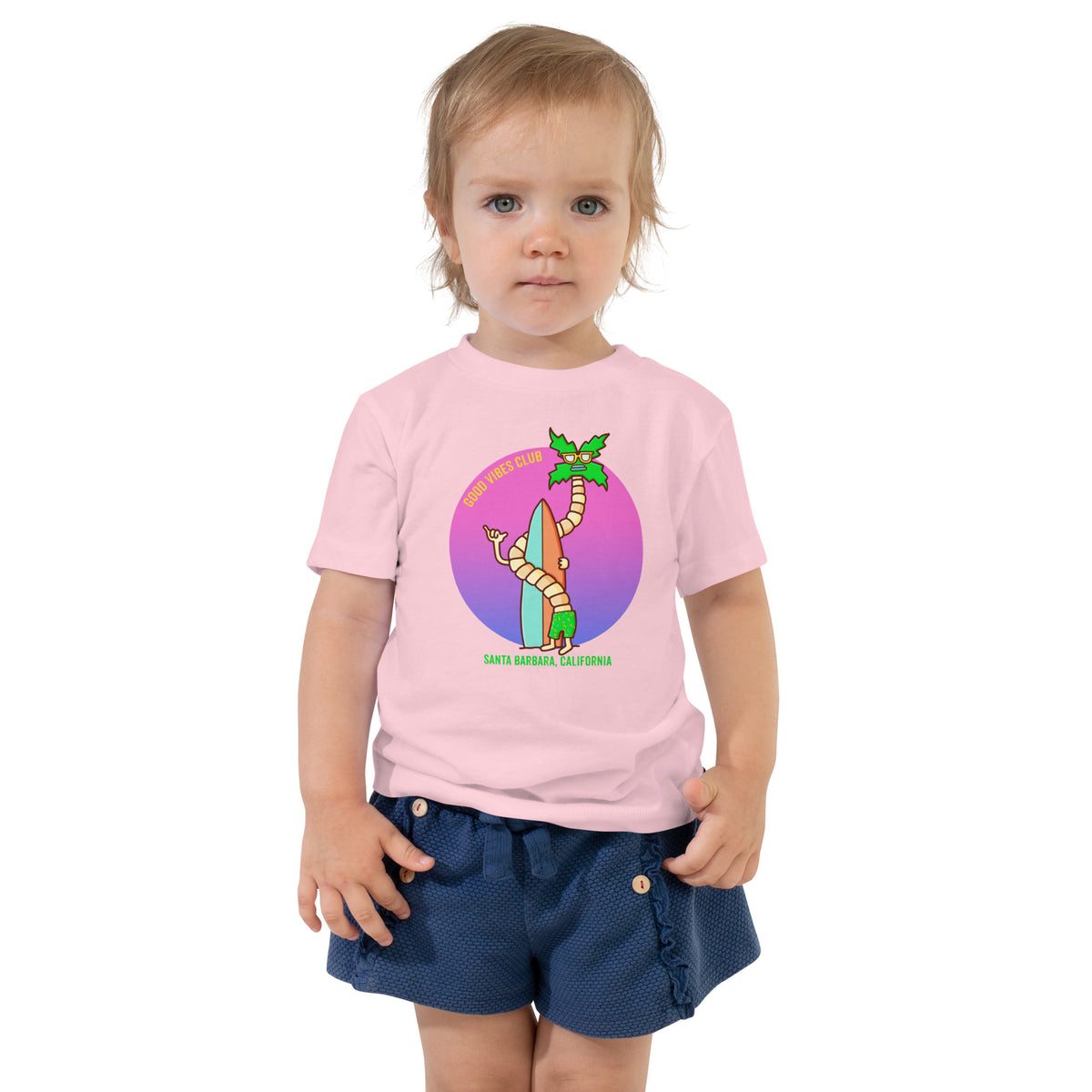 Hand-drawn palm tree and surf artwork on a bright California toddler t-shirt