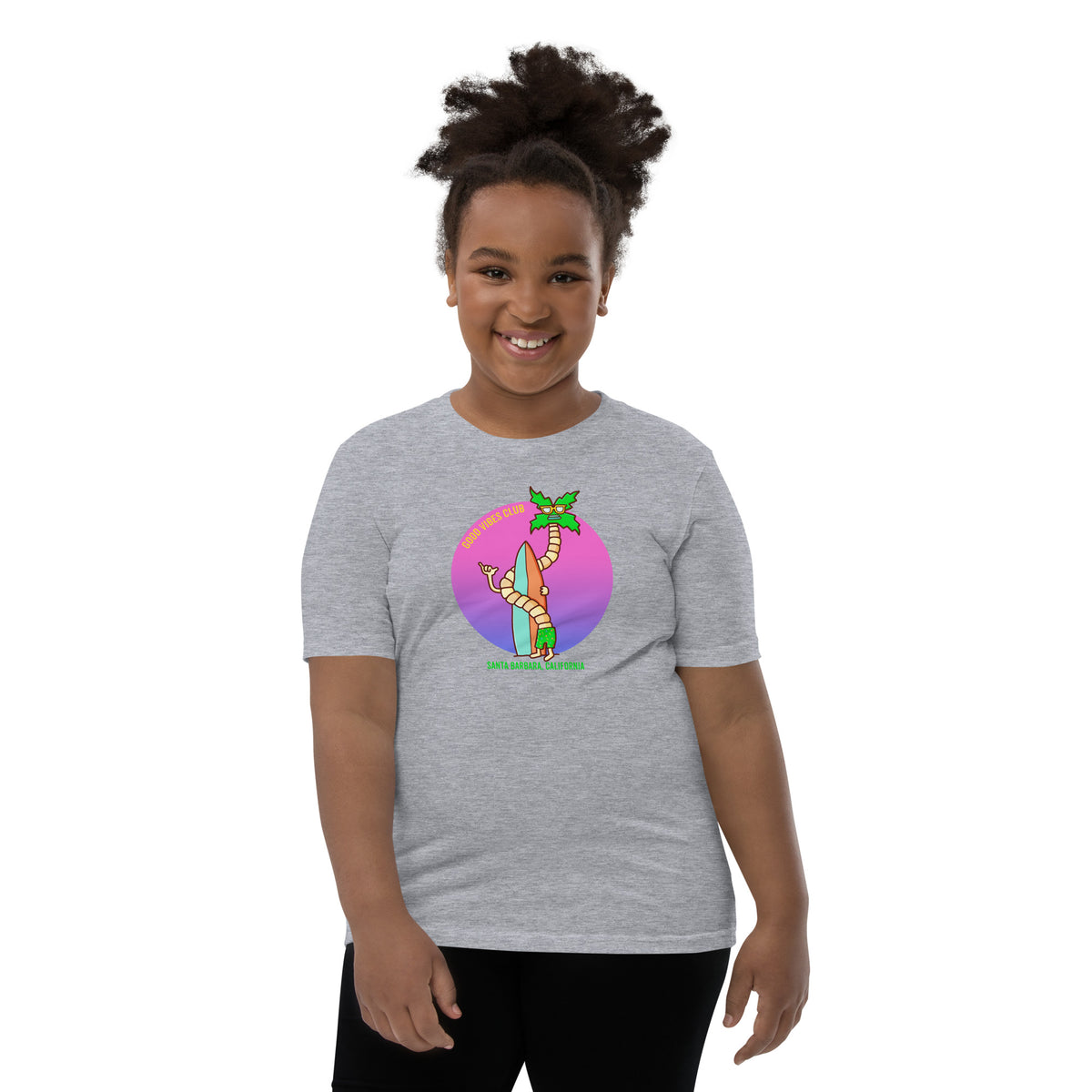 Youth beach tee with original palm and surfer artwork from Danvillage Art Lab